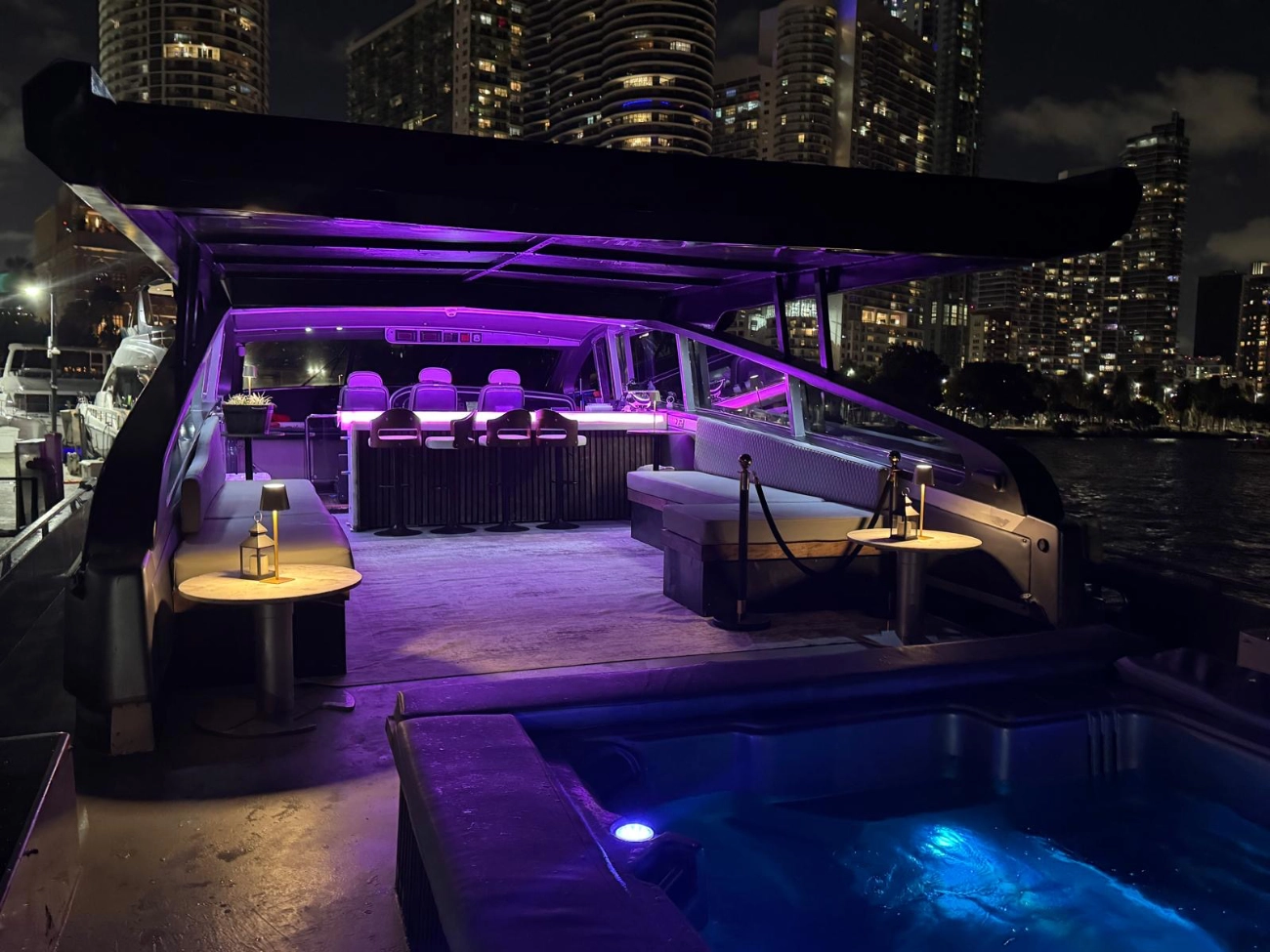 A luxury 90-foot yacht at night on Biscayne Bay